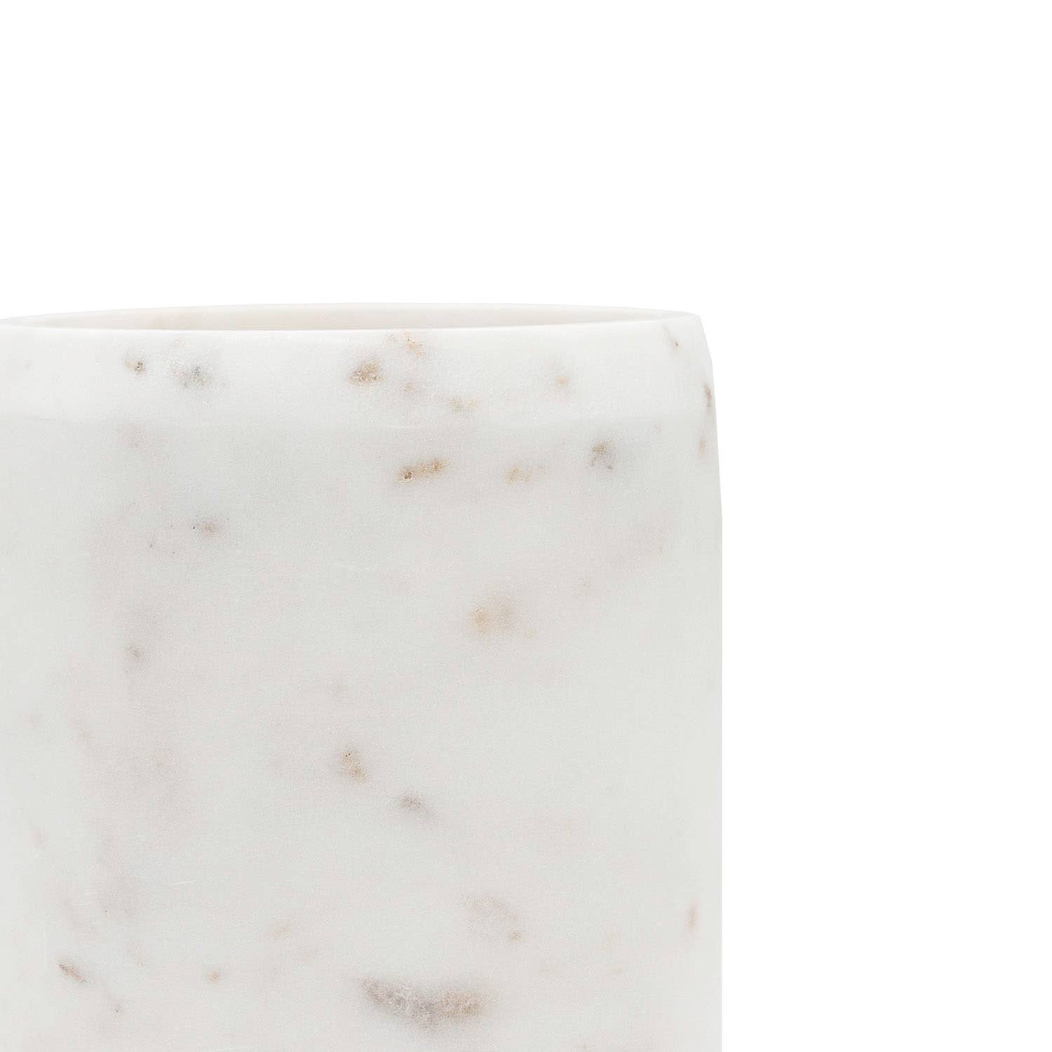 Close-up of authentic white marble showcasing unique natural veining and polished finish.