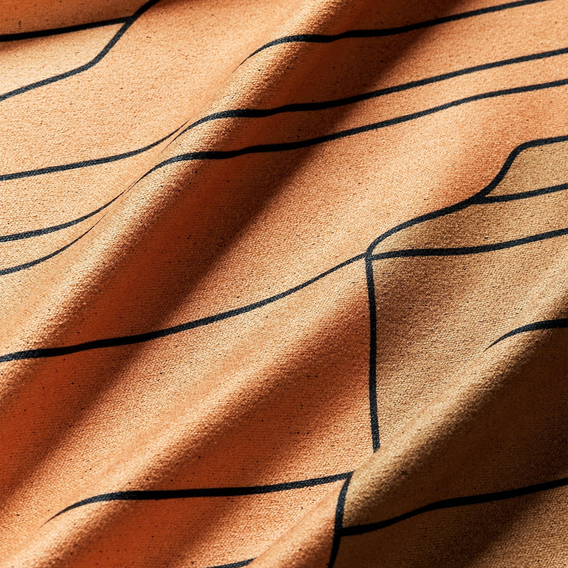 Close-up of the Grand Canyon National Park Nomadix towel highlighting the textured performance fabric, vibrant canyon-inspired artwork, and built-in hanging loop.