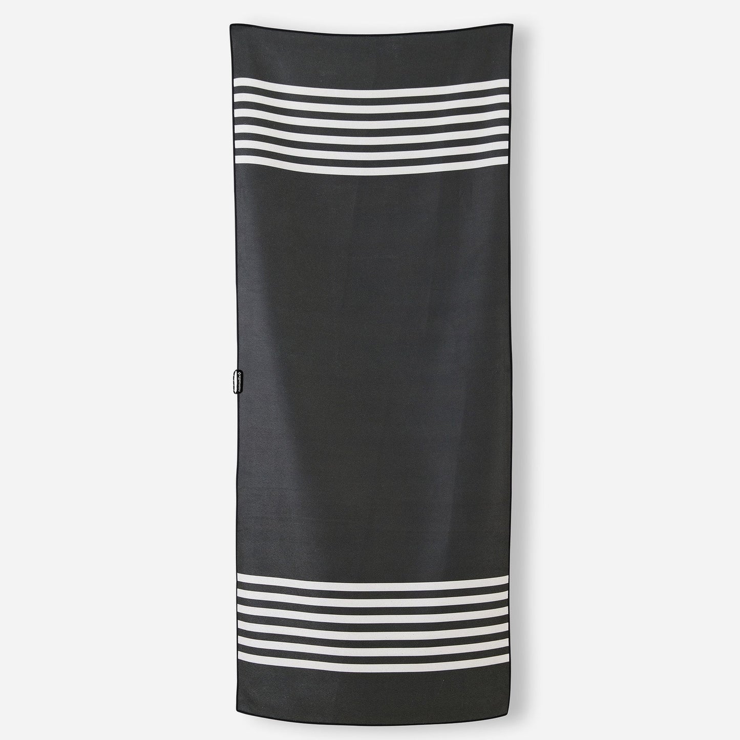 Nomadix Original Travel Towel in Poolside Black featuring a modern black striped design and quick-dry MicroTerry™ performance fabric.