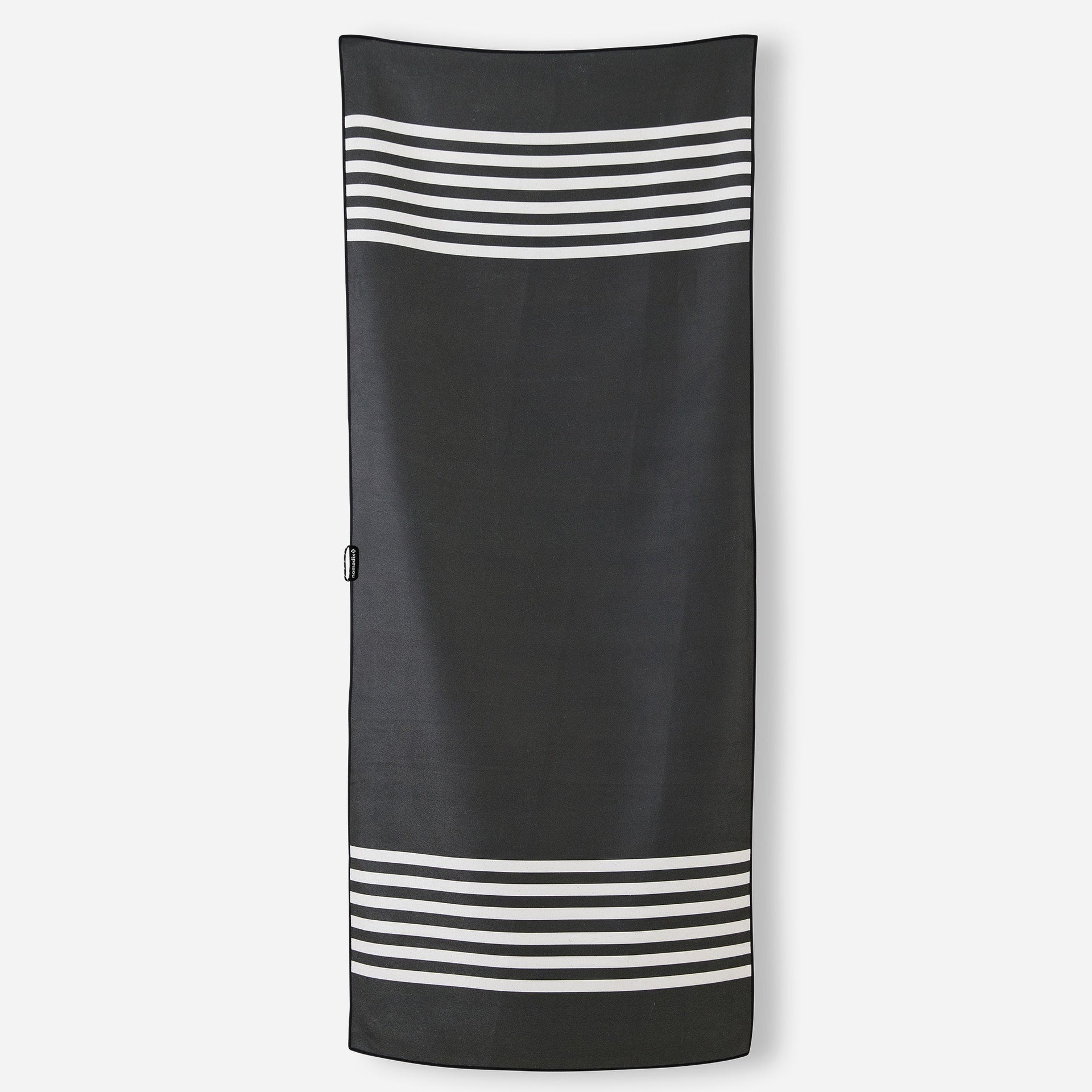Nomadix Original Travel Towel in Poolside Black featuring a modern black striped design and quick-dry MicroTerry™ performance fabric.