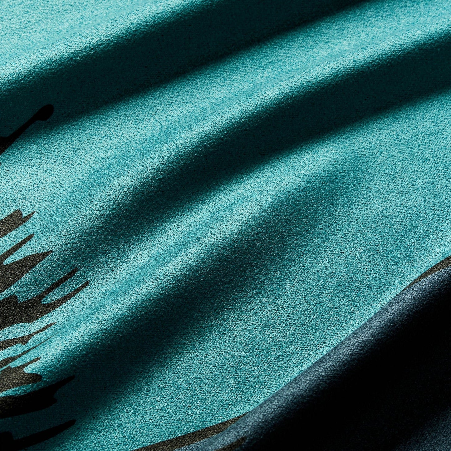 Close-up of the Great Smoky Mountains National Park Nomadix towel highlighting the textured performance fabric, scenic mountain artwork, and built-in hanging loop.