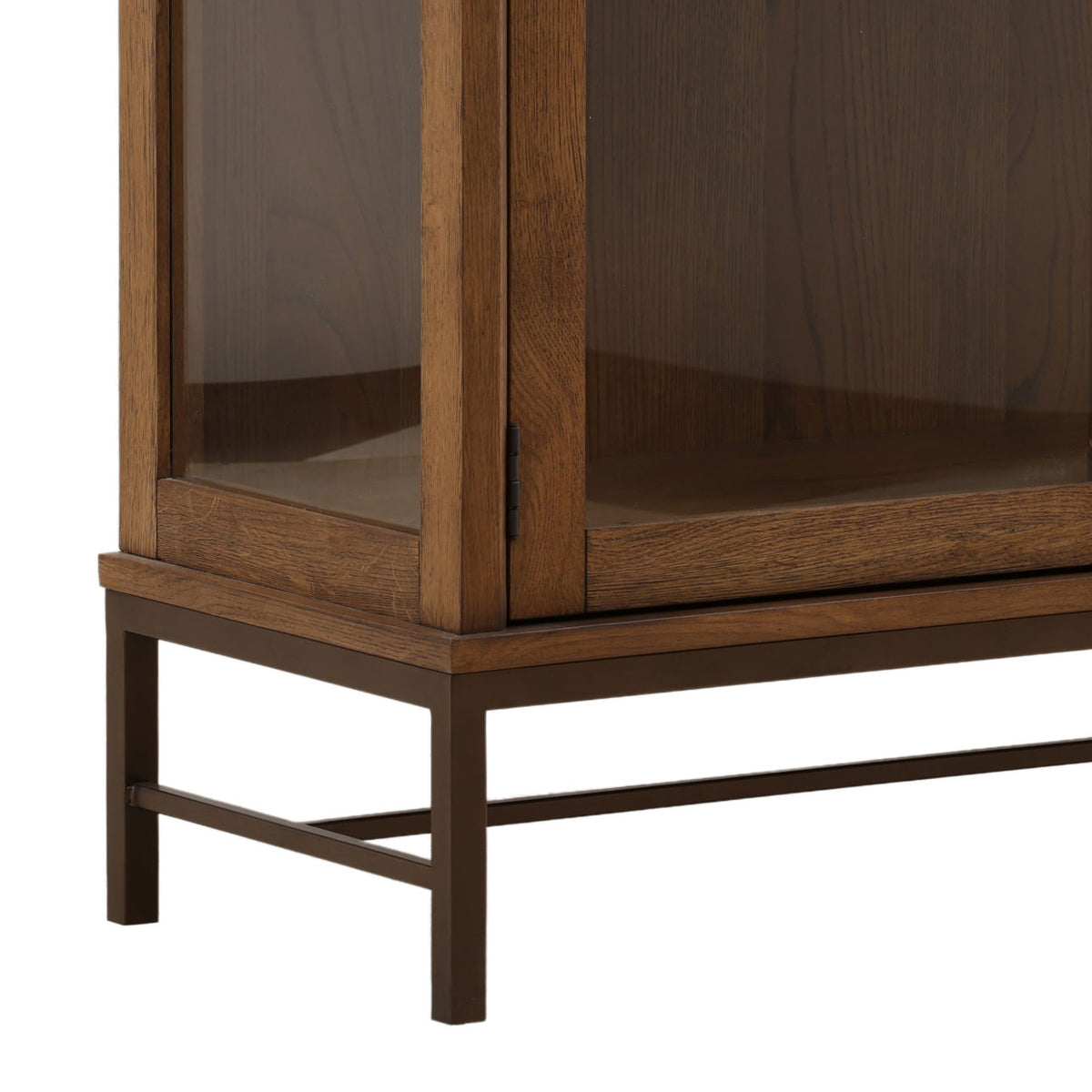 Hawthorne tall oak display cabinet in dark brown with glass-paneled doors and sides and a bronze-finished iron base.