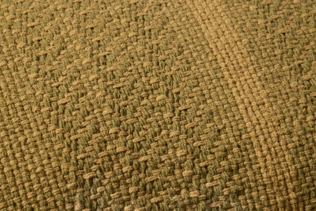 Close-up of the Blair lumbar pillow showcasing the handwoven cotton texture, knife-edge finish, and hidden zipper with antique bronze Loloi logo pull.
