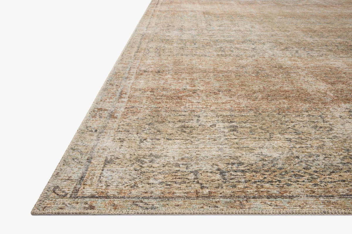 Close-up of the Cambria rug highlighting the woven jute texture and subtle Ocean blue and Brick color palette.