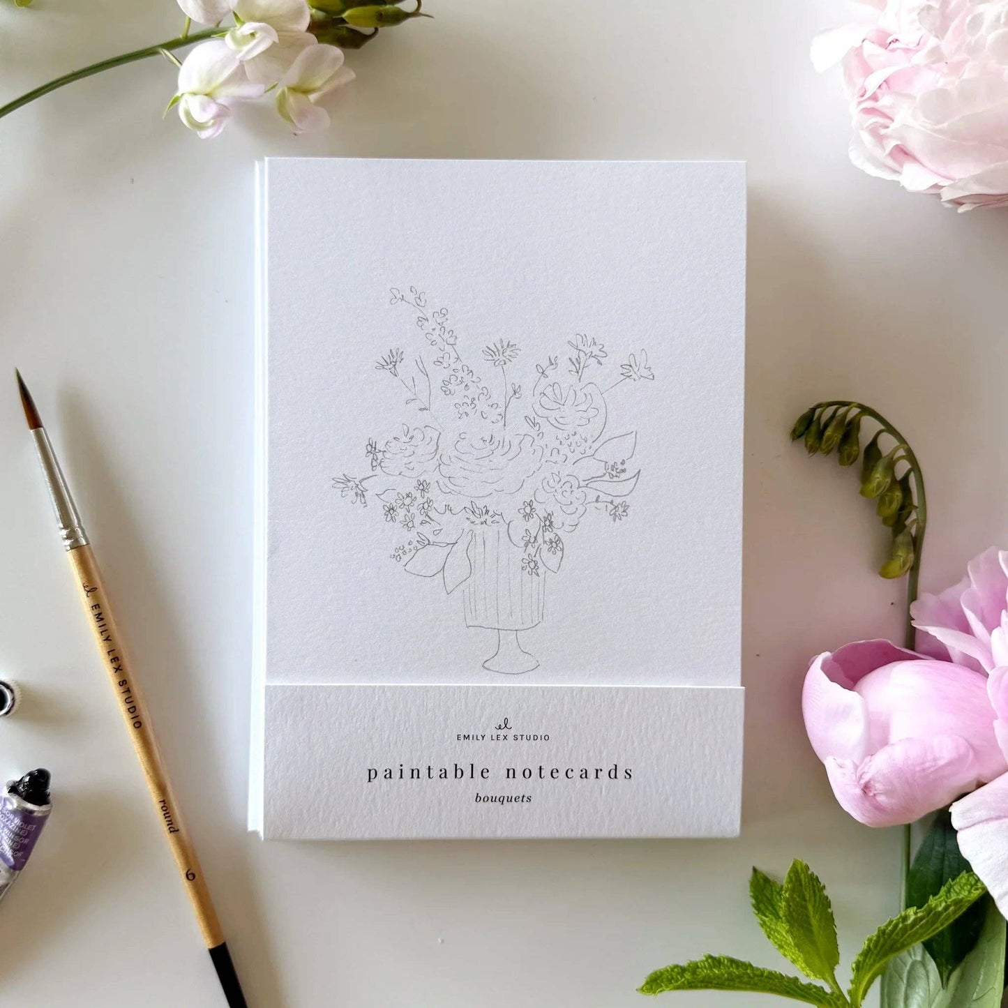 Paintable watercolor notecards with lightly sketched floral bouquet illustrations.