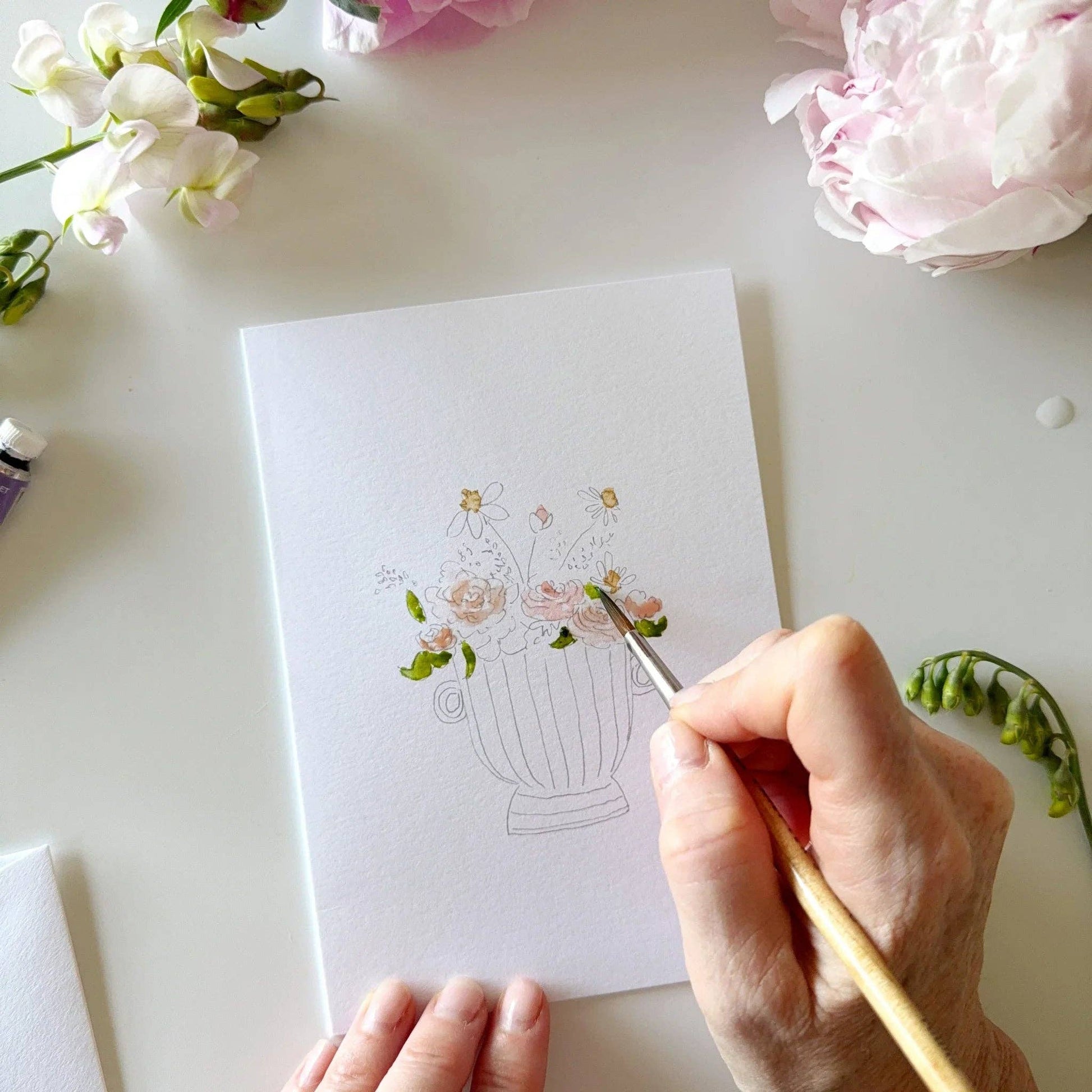 Bouquet paintable notecard set styled with watercolor supplies and botanical stationery.