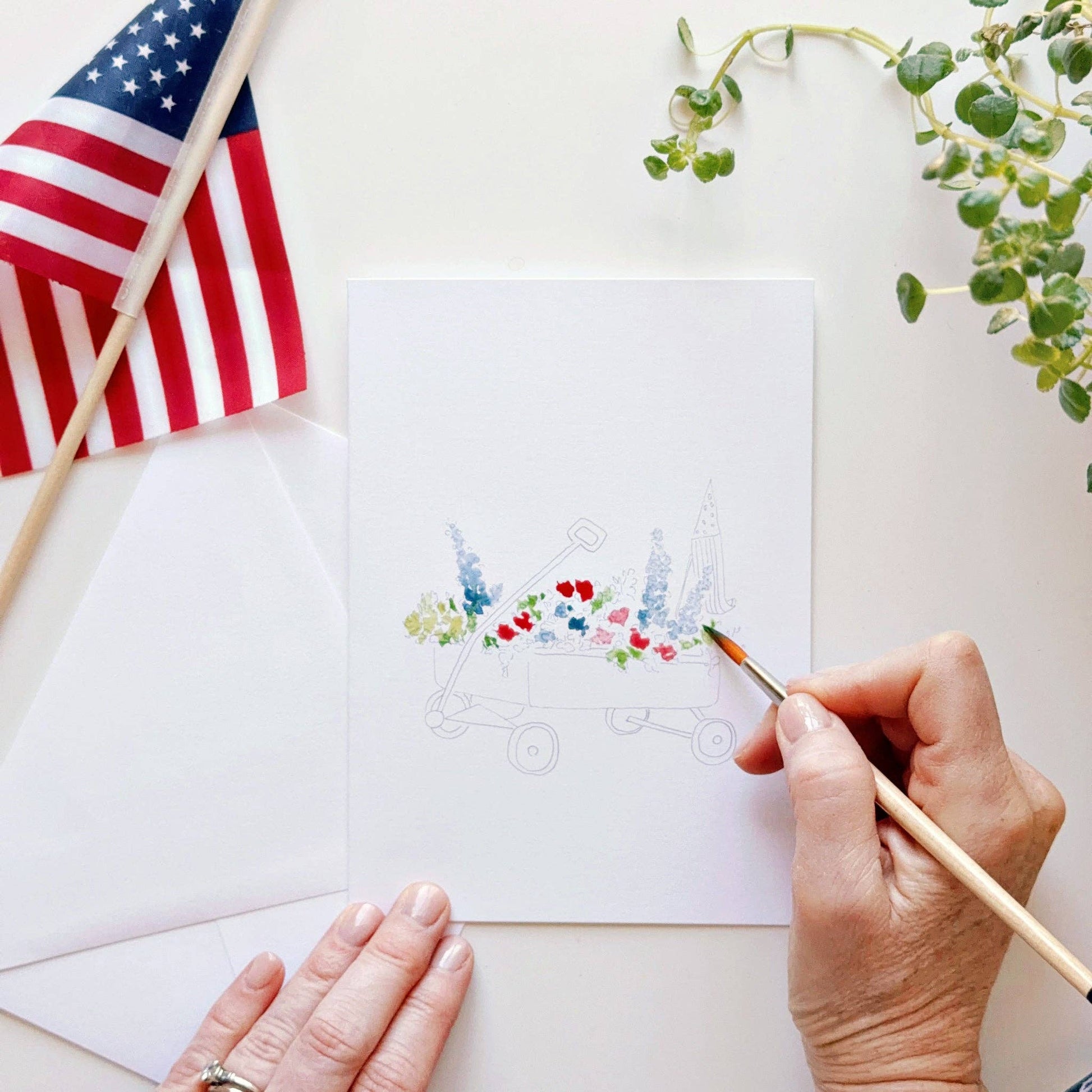 Paint-your-own watercolor notecards featuring flags, hydrangeas, bunting, and a flower-filled wagon.