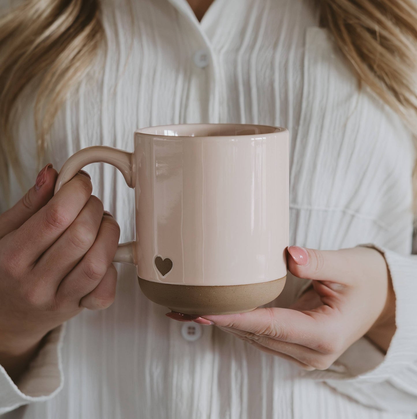 Heart stoneware mug with a soft blush finish, perfect for gifting or enjoying everyday coffee and tea.