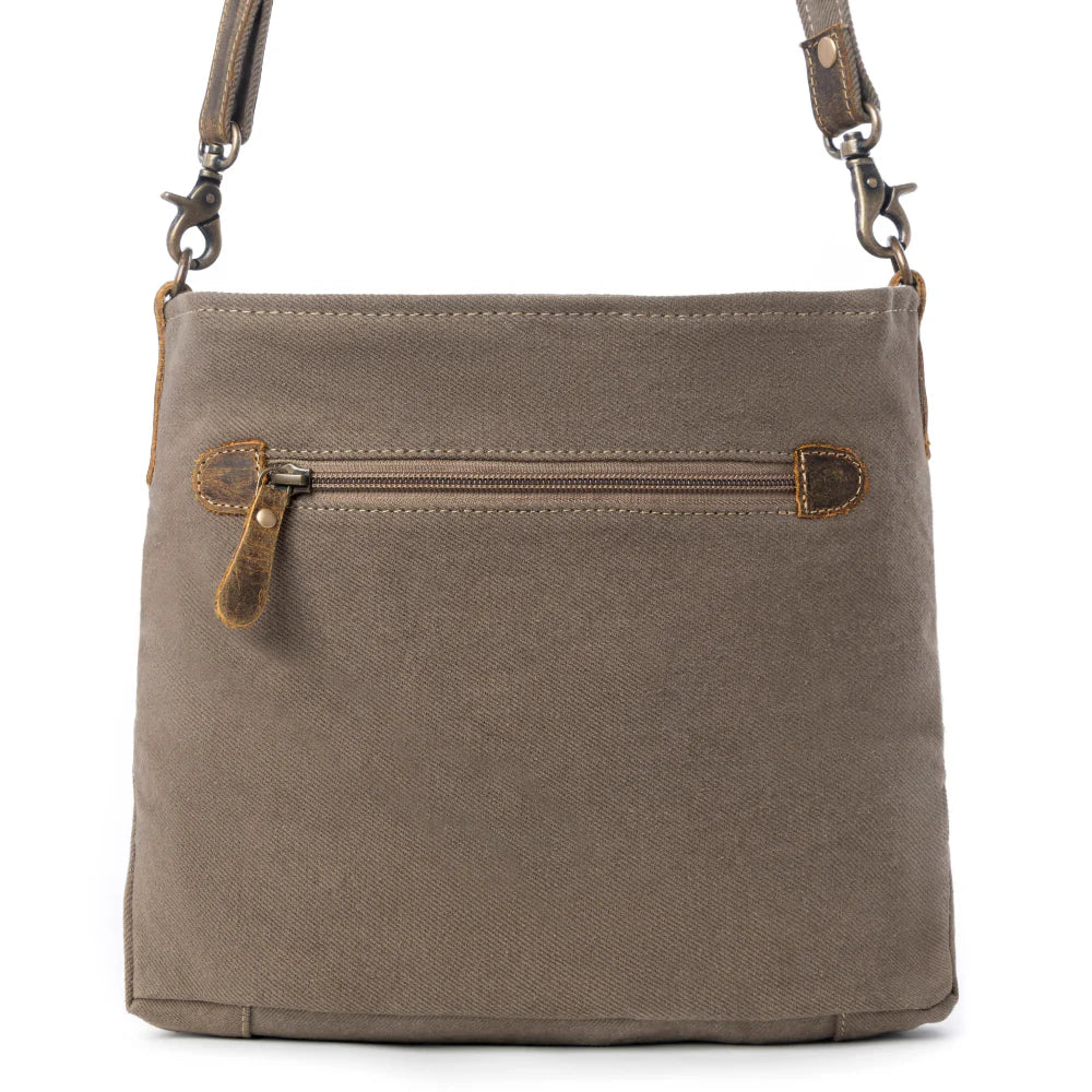 Brown leather crossbody bag with a zipper on a white background