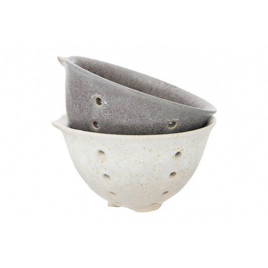 Cream and charcoal reactive glaze stoneware berry bowls with an open basket-inspired design.