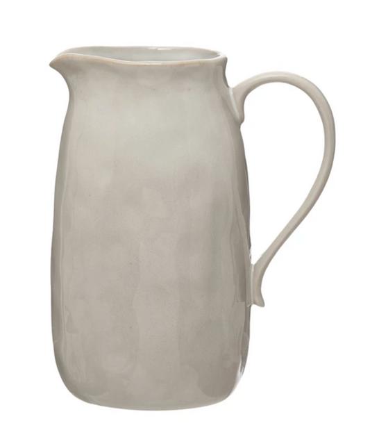 Large white reactive glaze stoneware pitcher with artisan-crafted texture and timeless silhouette.