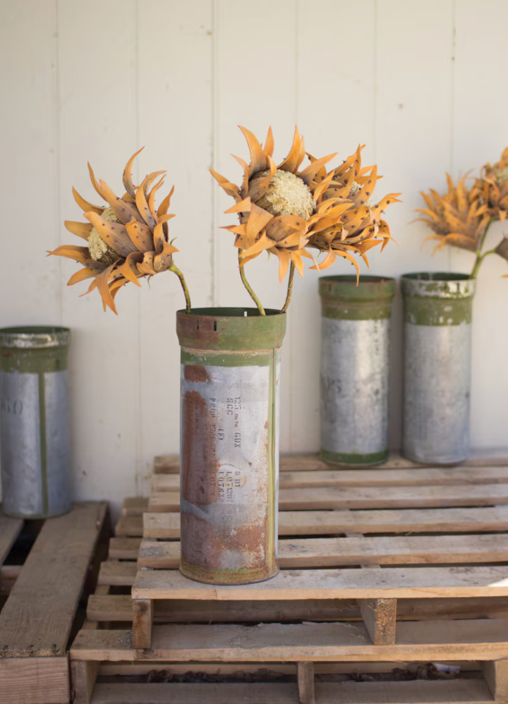 Authentic reclaimed military storage canister refurbished for decorative home use.