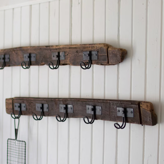 Reclaimed wood coat rack featuring five wire hooks for everyday storage.