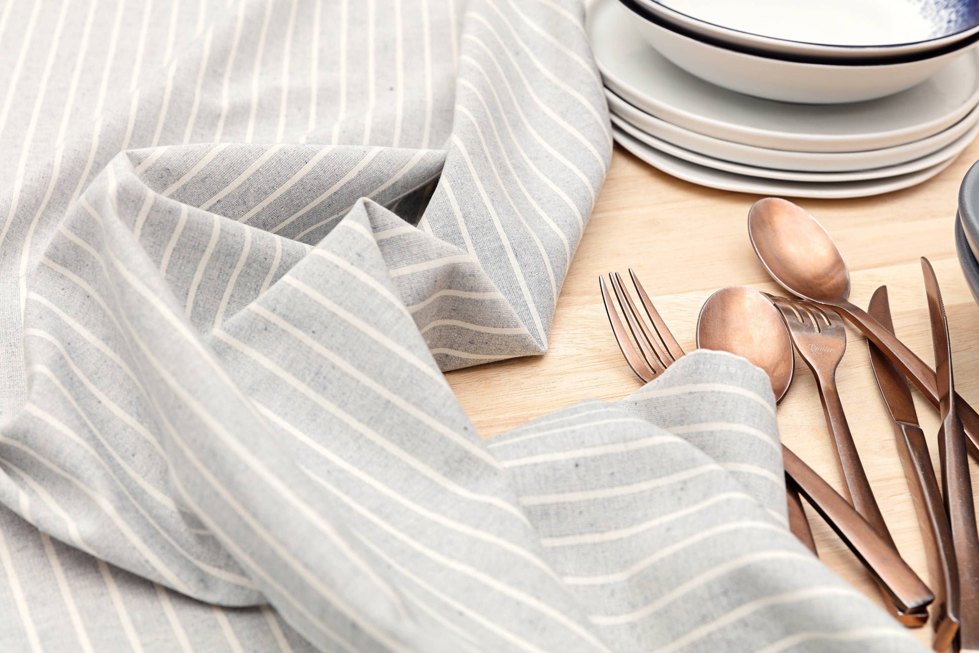 Set of four dusty blue striped cotton napkins for everyday dining and entertaining.