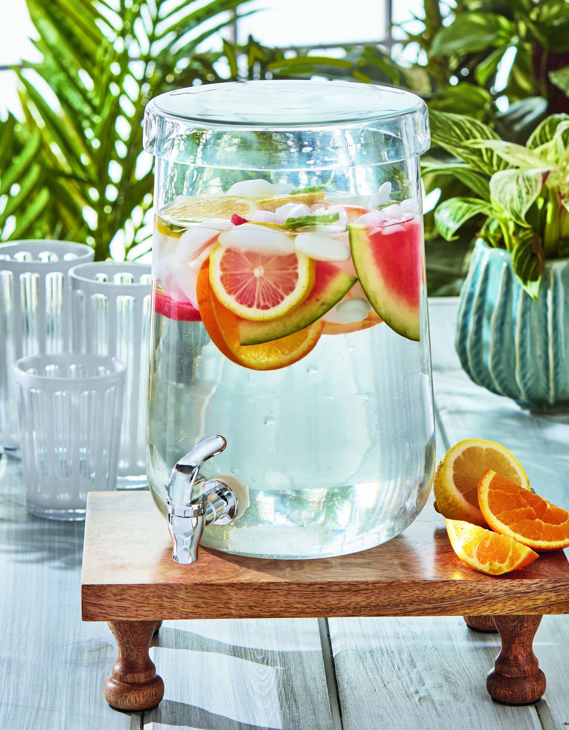 Clear glass Form drink dispenser handcrafted from recycled artisan glass styled for gathered entertaining and brunch tables
