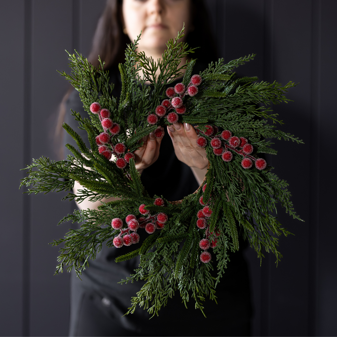 Red Plum Berry Norfolk Cypress Wreath featuring realistic evergreen foliage and frosted red plum berries.