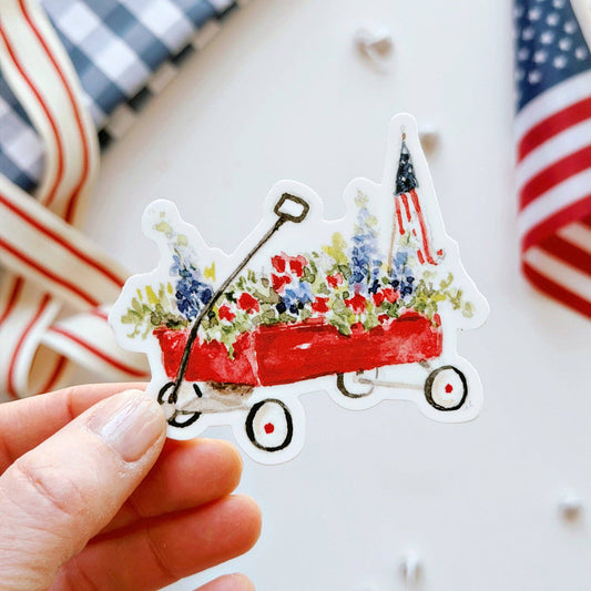 Red wagon vinyl sticker featuring original watercolor artwork by Emily Lex.