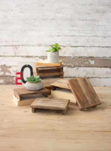 Handcrafted decorative riser made from repurposed wood with a naturally weathered finish.