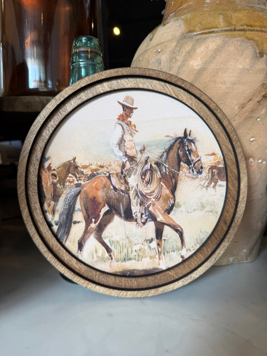 Round Vintage Cowboy Framed Canvas Art featuring a timeless cowboy portrait in a handcrafted round wood frame with an Early American finish.