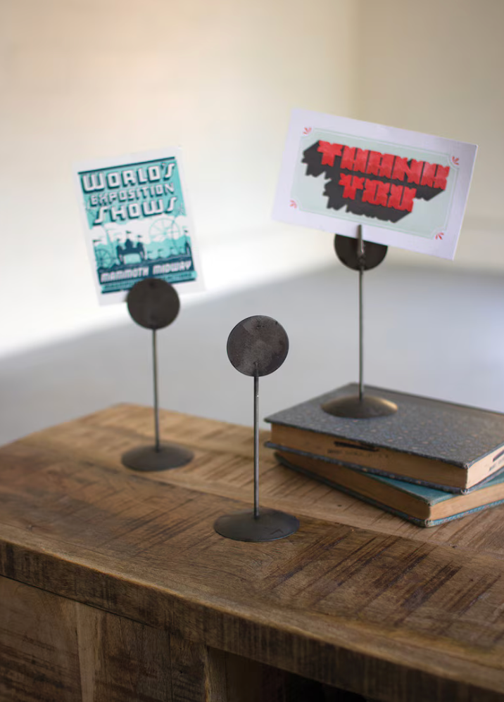 Round wire photo and card stand for displaying photos, artwork, and notes.