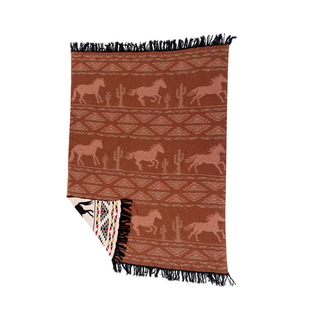 Chisholm Trail Woven Throw Blanket featuring running horses, tribal-inspired geometric patterns, and saguaro cacti in a timeless Western design.