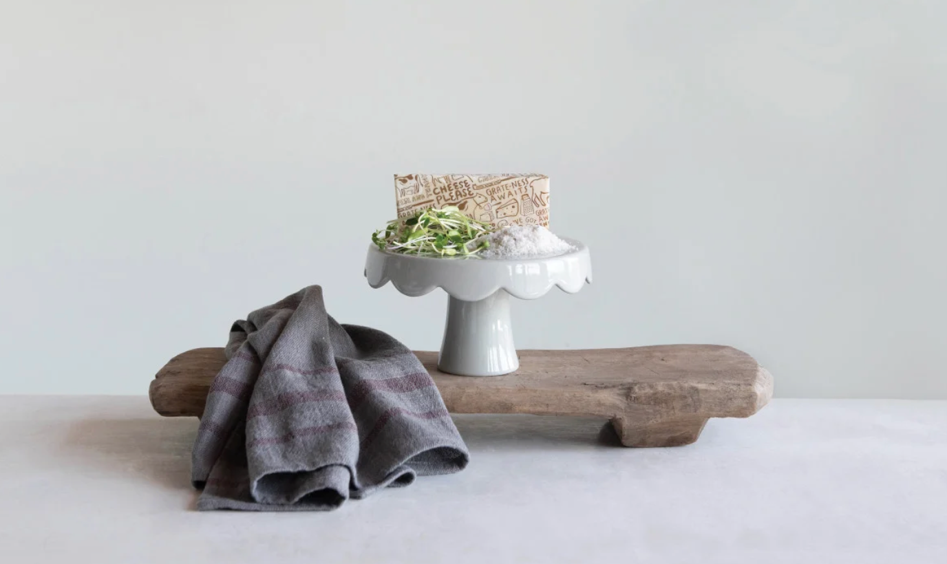 Found wood decorative board displayed in an organic modern home with layered natural materials and collected décor.