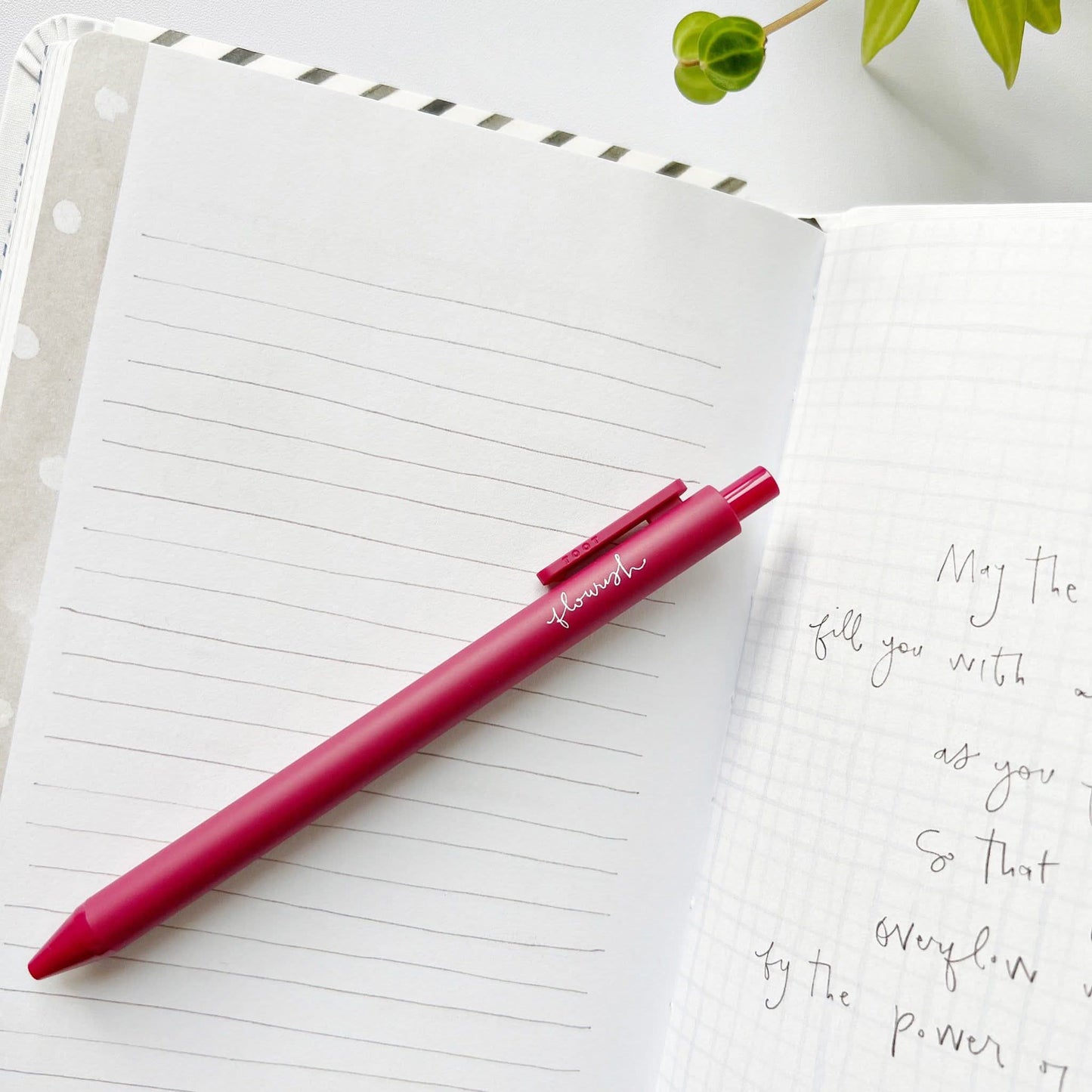 Matte finish gel ink pen featuring the word “flourish” in handwritten script.