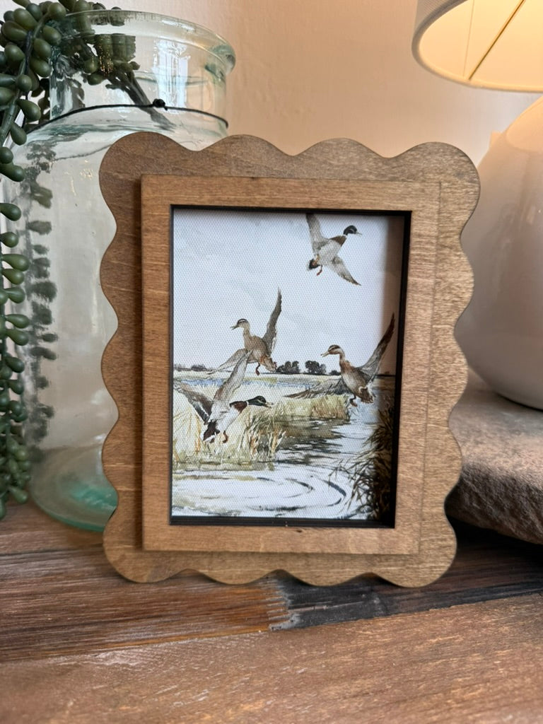 Scallop Mallards Framed Canvas Art featuring a timeless mallard illustration in a handcrafted scalloped wood frame with an Early American finish.
