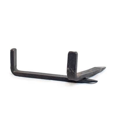 Small 3-inch iron tarp nail for hanging decorative wall textiles and artwork.