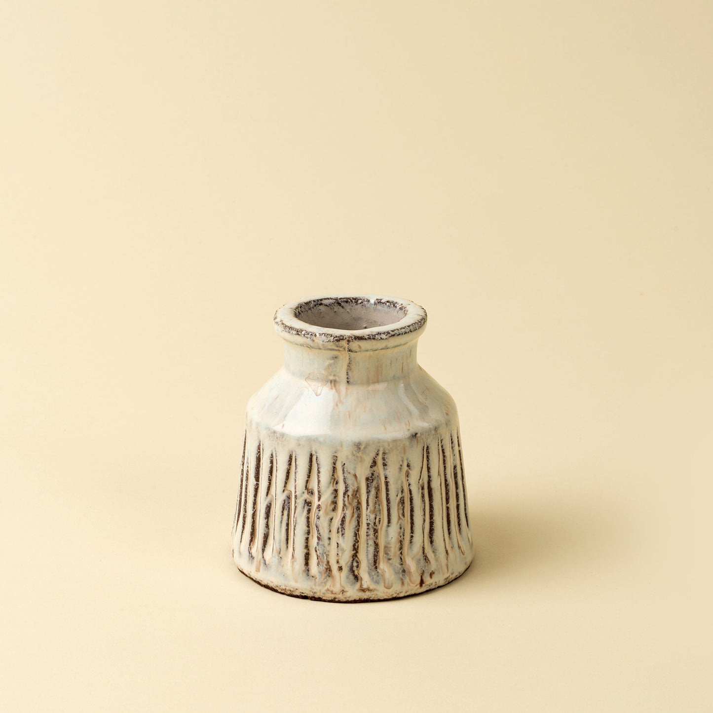 The Solara Ridge Vase – Small handcrafted from terracotta with a glossy cream glaze.