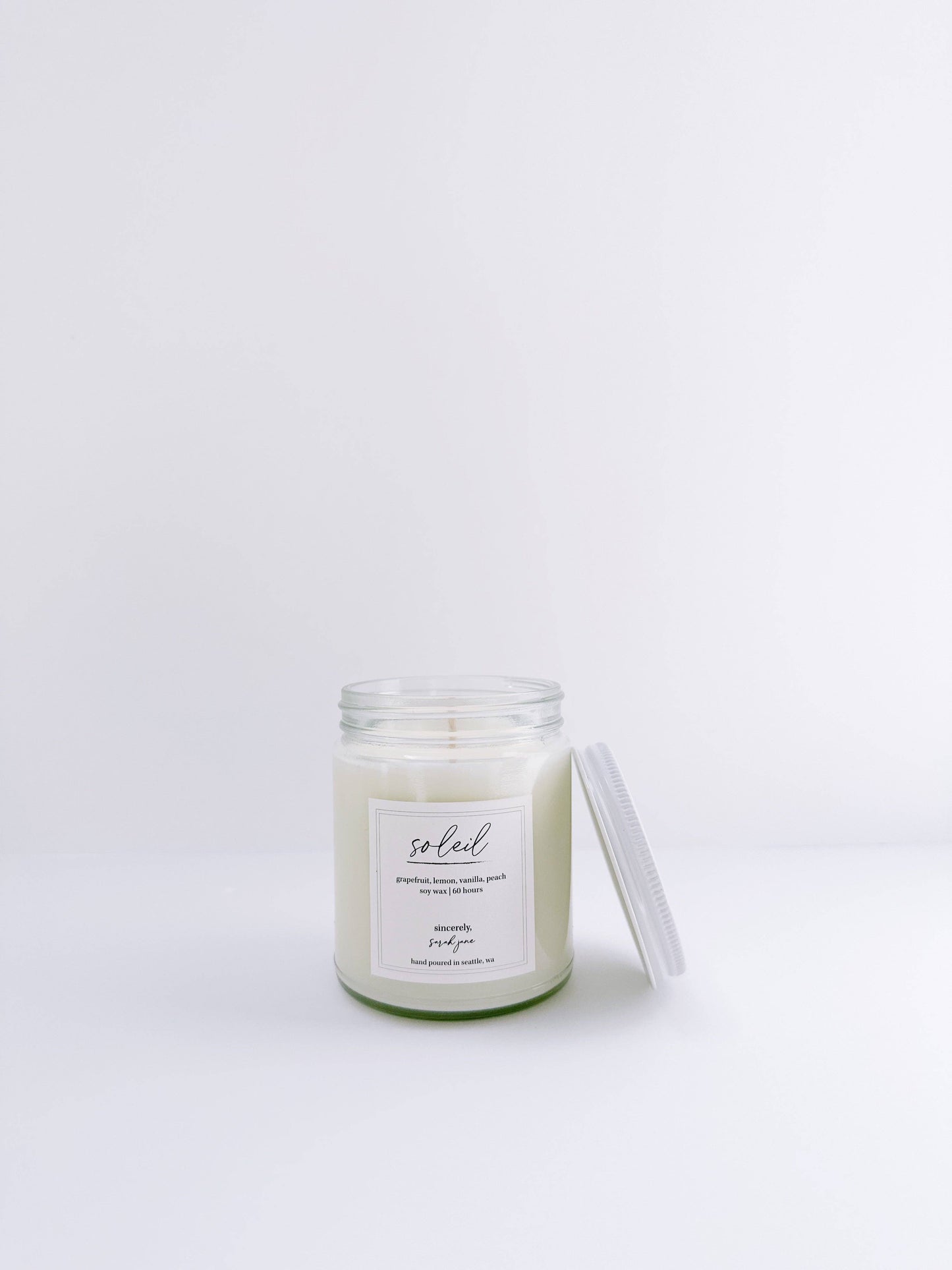 Soleil 8 oz soy candle with notes of grapefruit, peach, lemon, and vanilla.