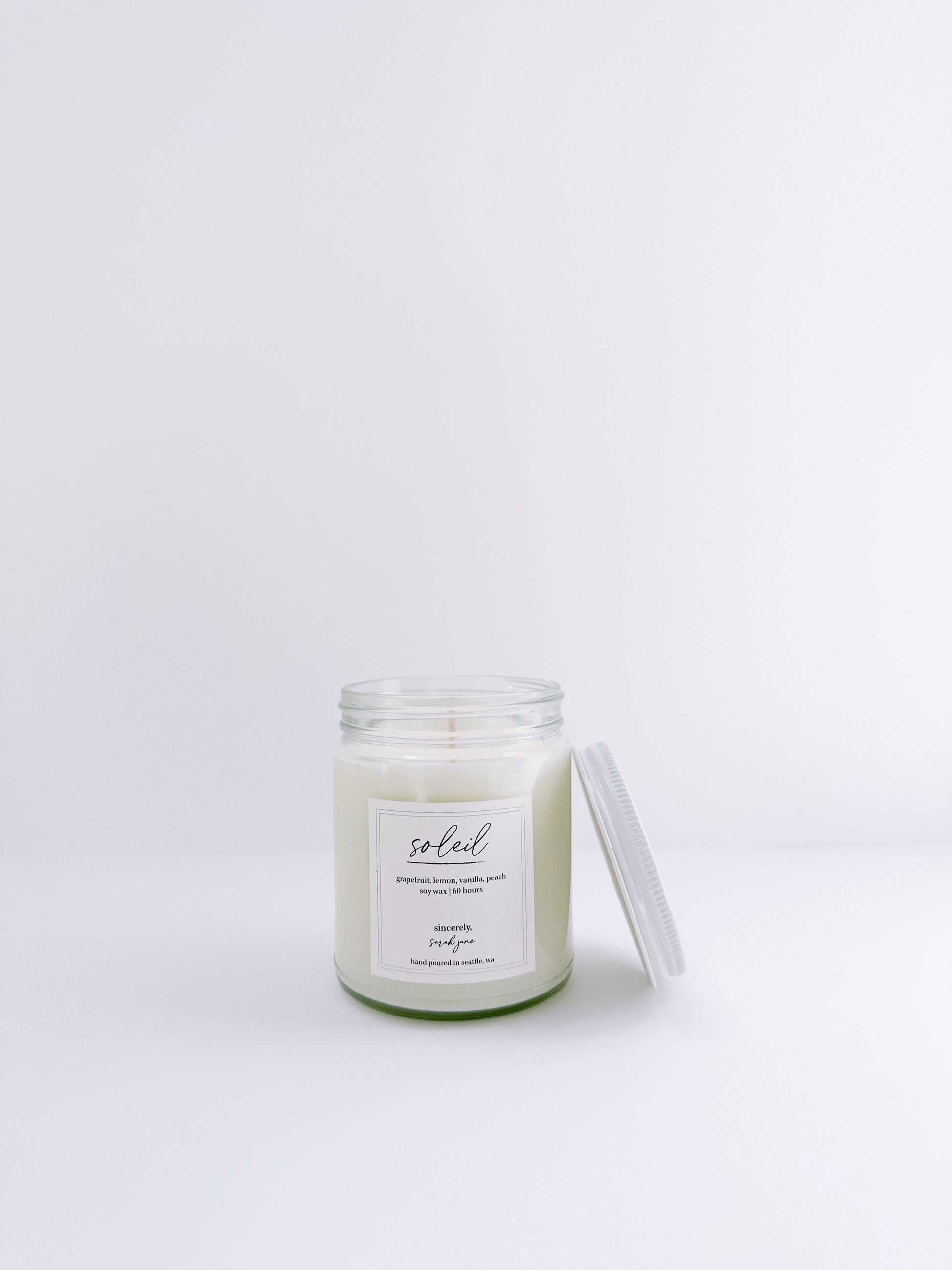 Soleil 8 oz soy candle with notes of grapefruit, peach, lemon, and vanilla.