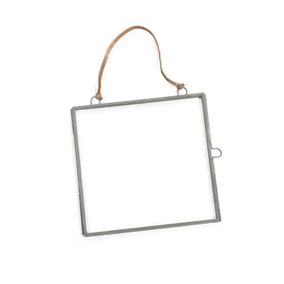 Square hanging picture frames in brass and zinc finishes, each measuring 7 by 7 inches with a brown suede hanging strap.