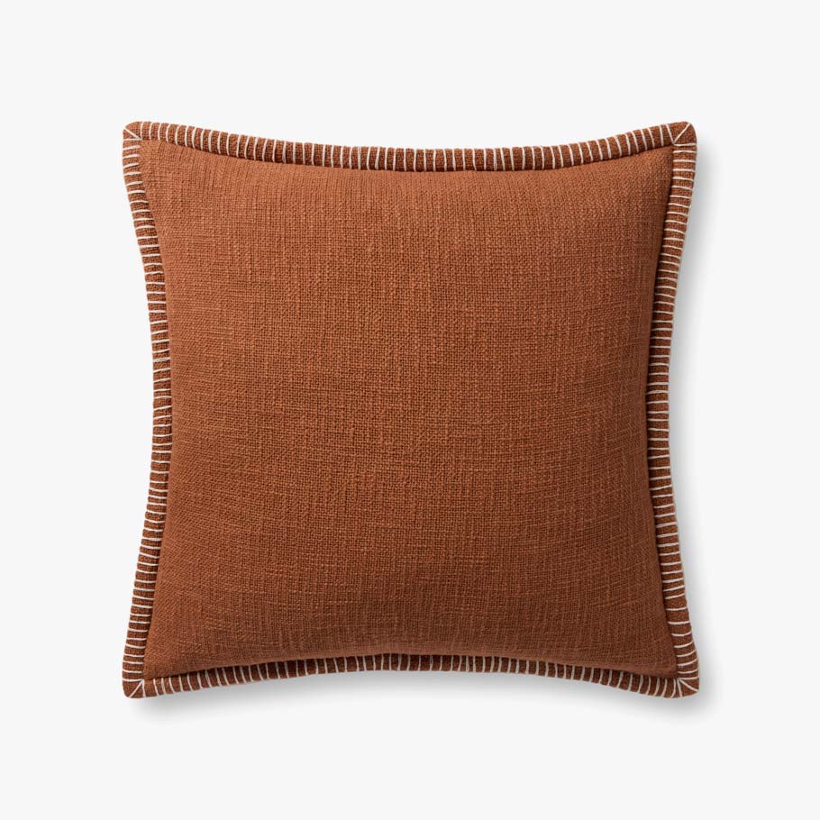 Terracotta decorative throw pillow crafted from 100% cotton with white contrast stitching, a flange edge, and a premium down-filled insert.