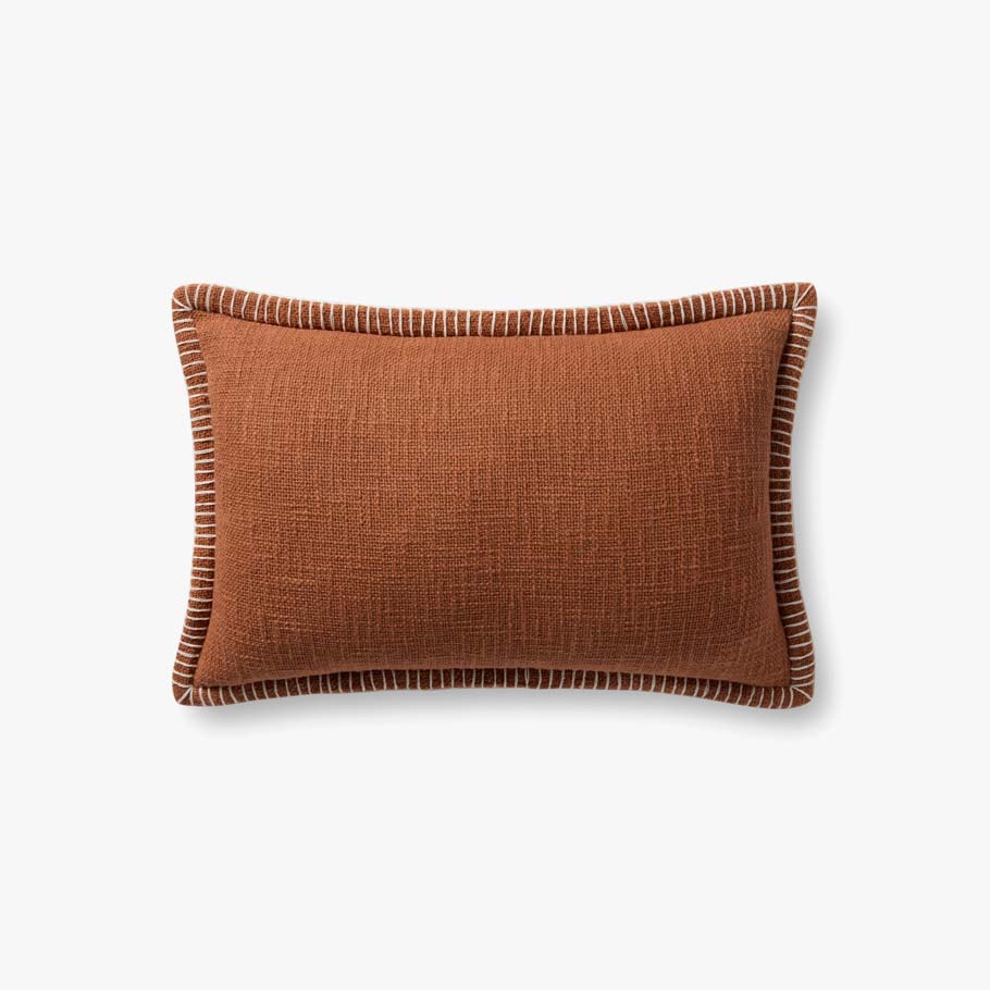 Terracotta decorative throw pillow crafted from 100% cotton with white contrast stitching, a flange edge, and a premium down-filled insert.