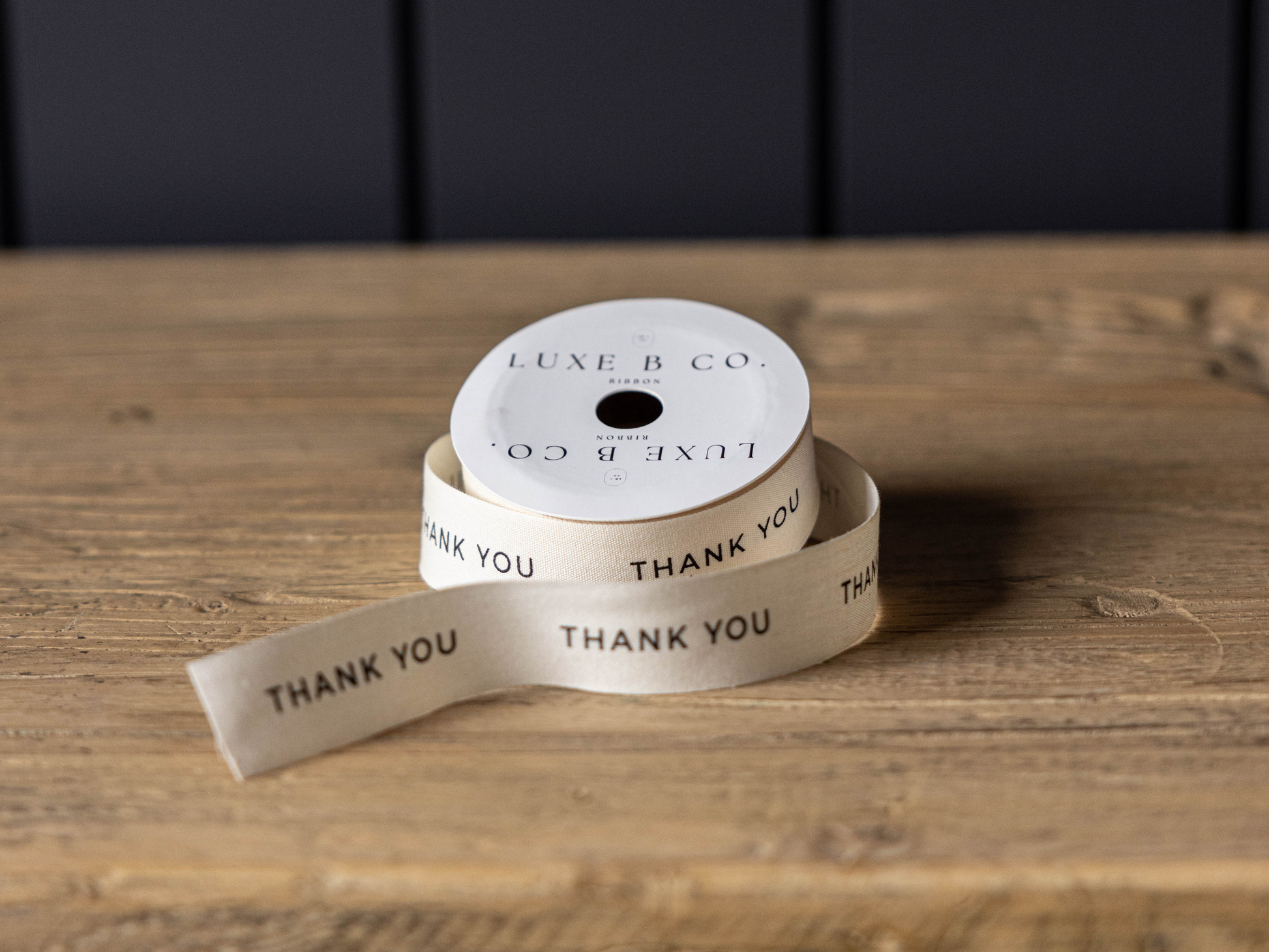 Medium Thank You printed ribbon spool measuring 1 inch wide for gift wrapping and decorative packaging.