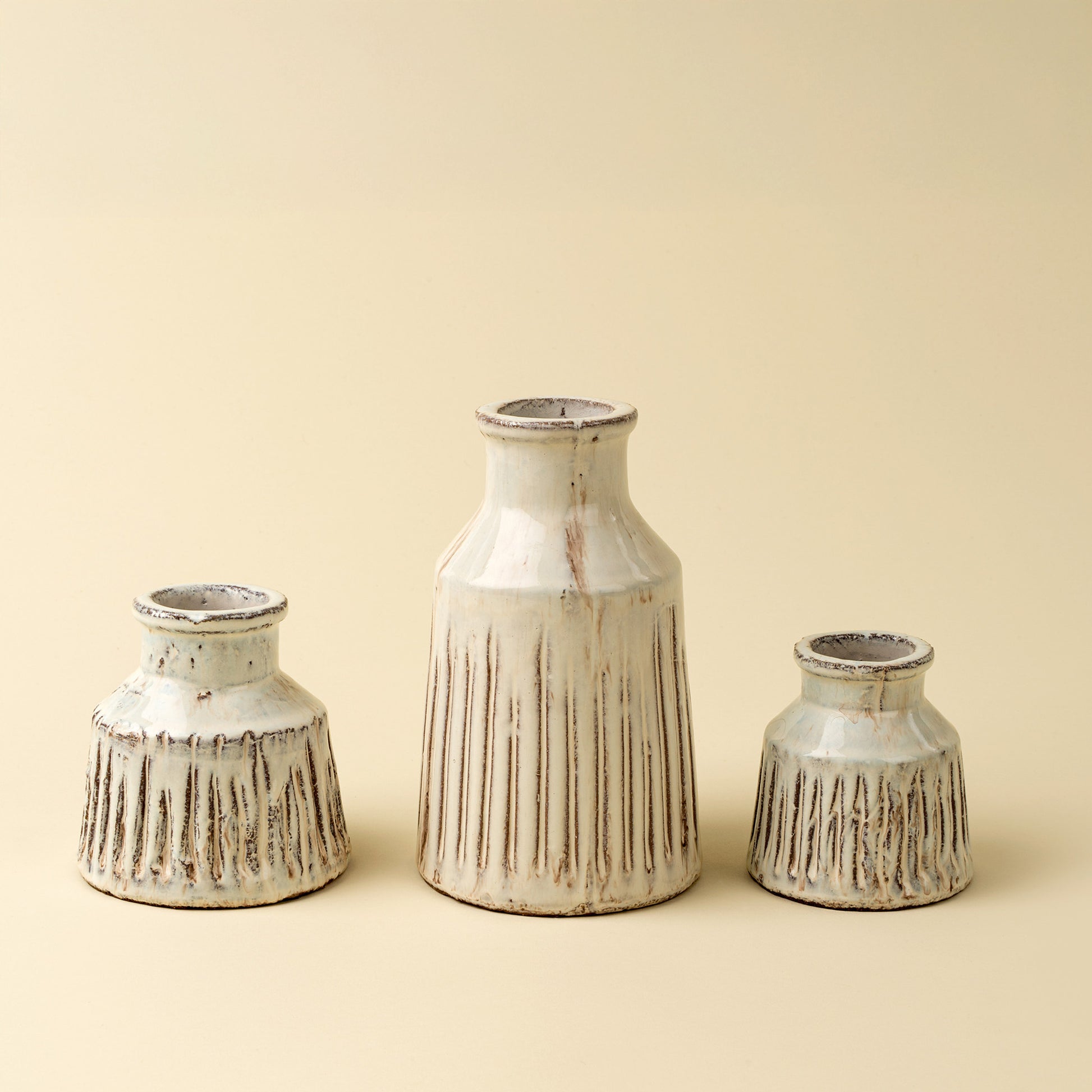 Large ridged terracotta vase with artisan texture and sculptural detailing.