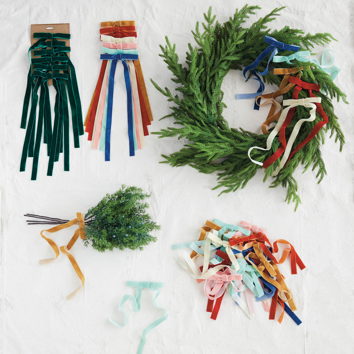 Set of six velvet clip-on bows in assorted rich colors for Christmas tree and holiday decorating.