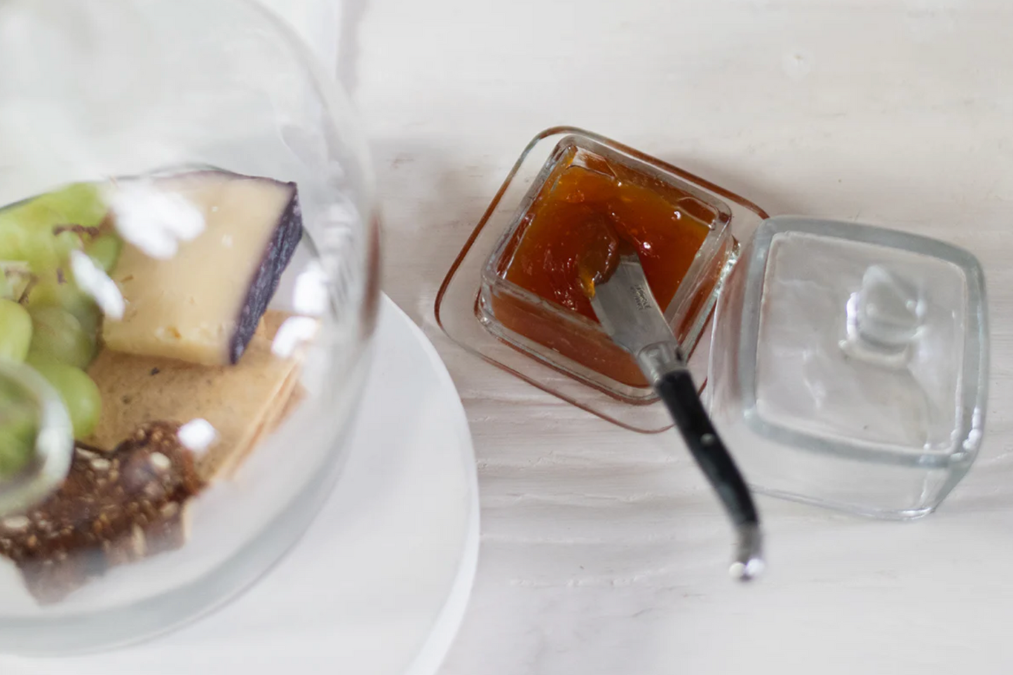 French Bistro glass jam jar crafted from recycled artisan glass styled on a gathered breakfast table