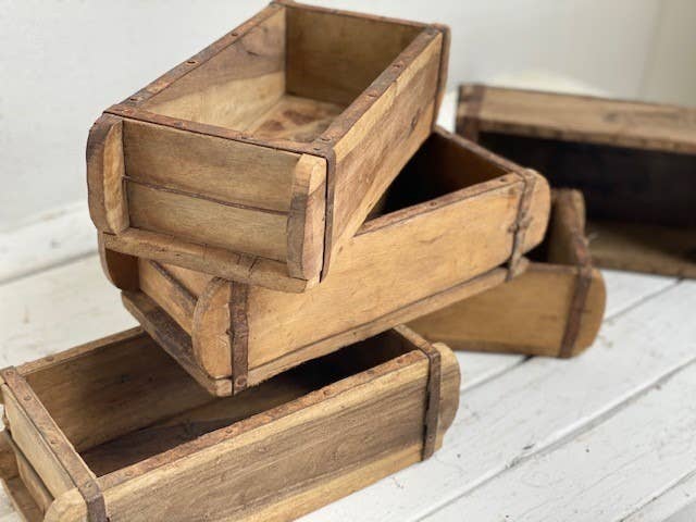 Reclaimed wooden brick mold adding warmth, history, and character to an organic modern home.