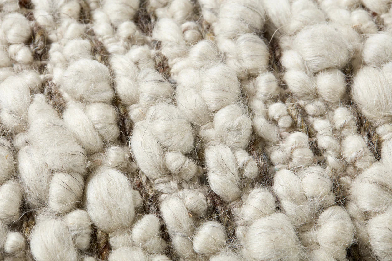 Close-up of the handwoven wool and cotton texture on the Amber Lewis Vivienne lumbar pillow.