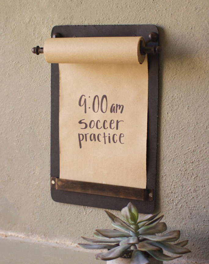 Wall-mounted note roll board for lists, reminders, and family messages.