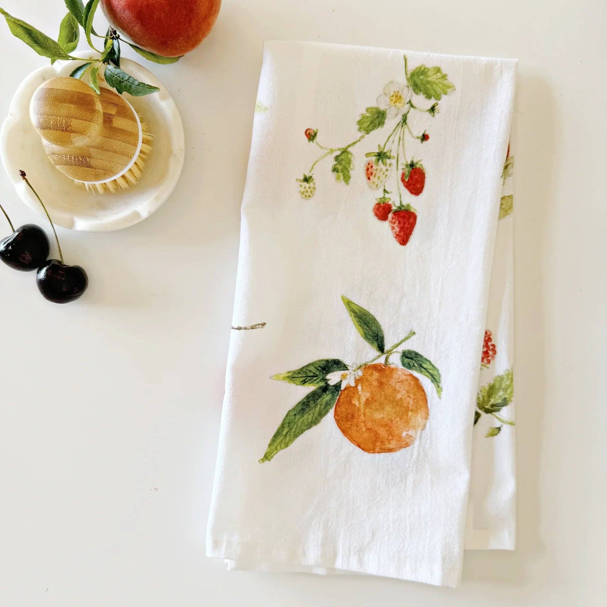 Botanical fruit watercolor illustrations printed on a soft cotton flour sack tea towel.