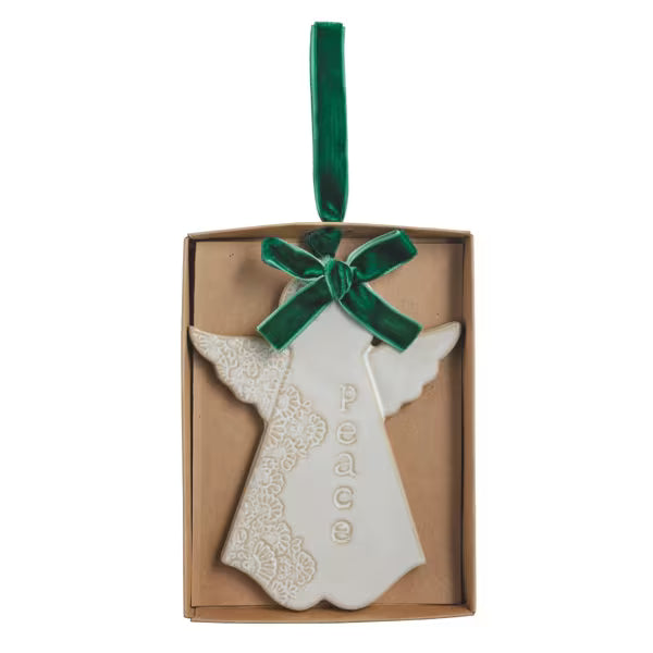 White stoneware angel ornament with a reactive glaze finish and velvet ribbon.