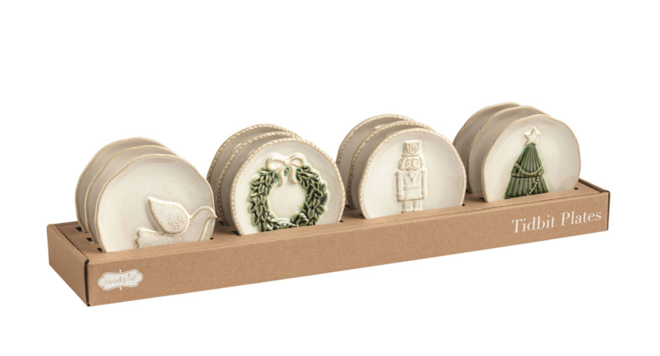 White ceramic Christmas tidbit plate with a raised holiday design and reactive glaze finish.