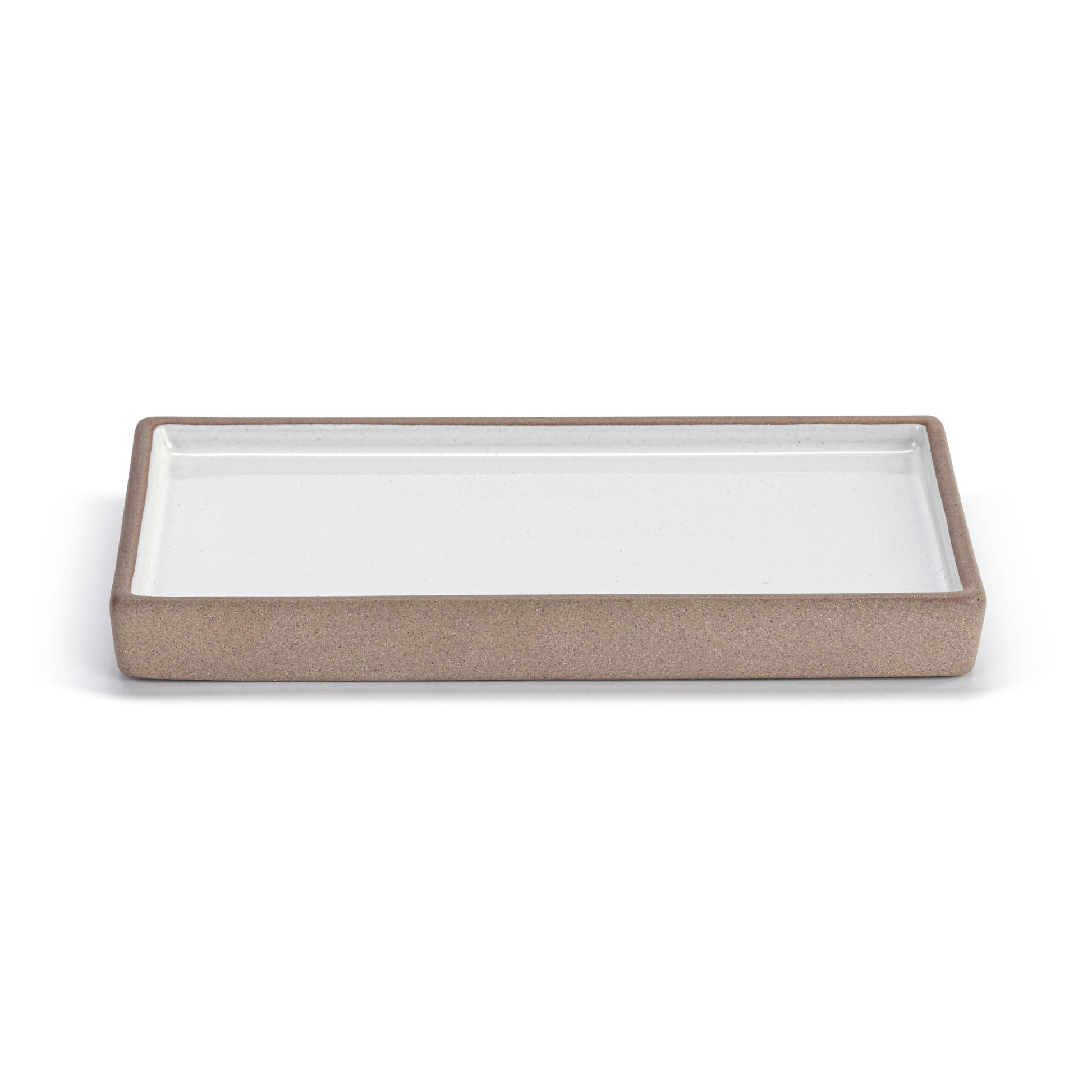 White and natural rectangular ceramic catchall tray.