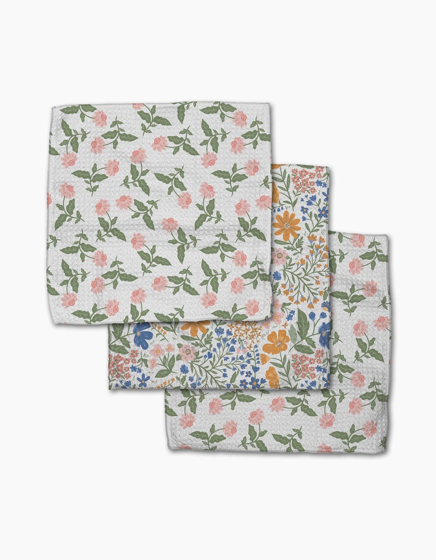 Set of three floral-patterned cloths on a white background