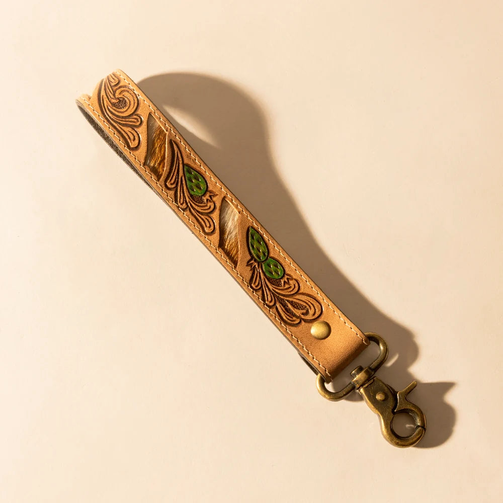 Wildvine Pony hand-tooled tan leather key fob with genuine hair-on hide and green cactus detailing.