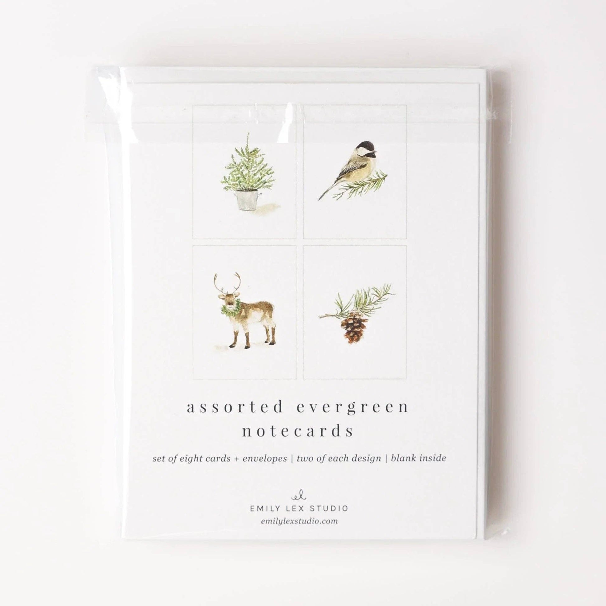 Evergreen Christmas Watercolor Notecard Set by Emily Lex featuring watercolor illustrations of a chickadee, pinecone, reindeer, and potted evergreen tree with coordinating envelopes.