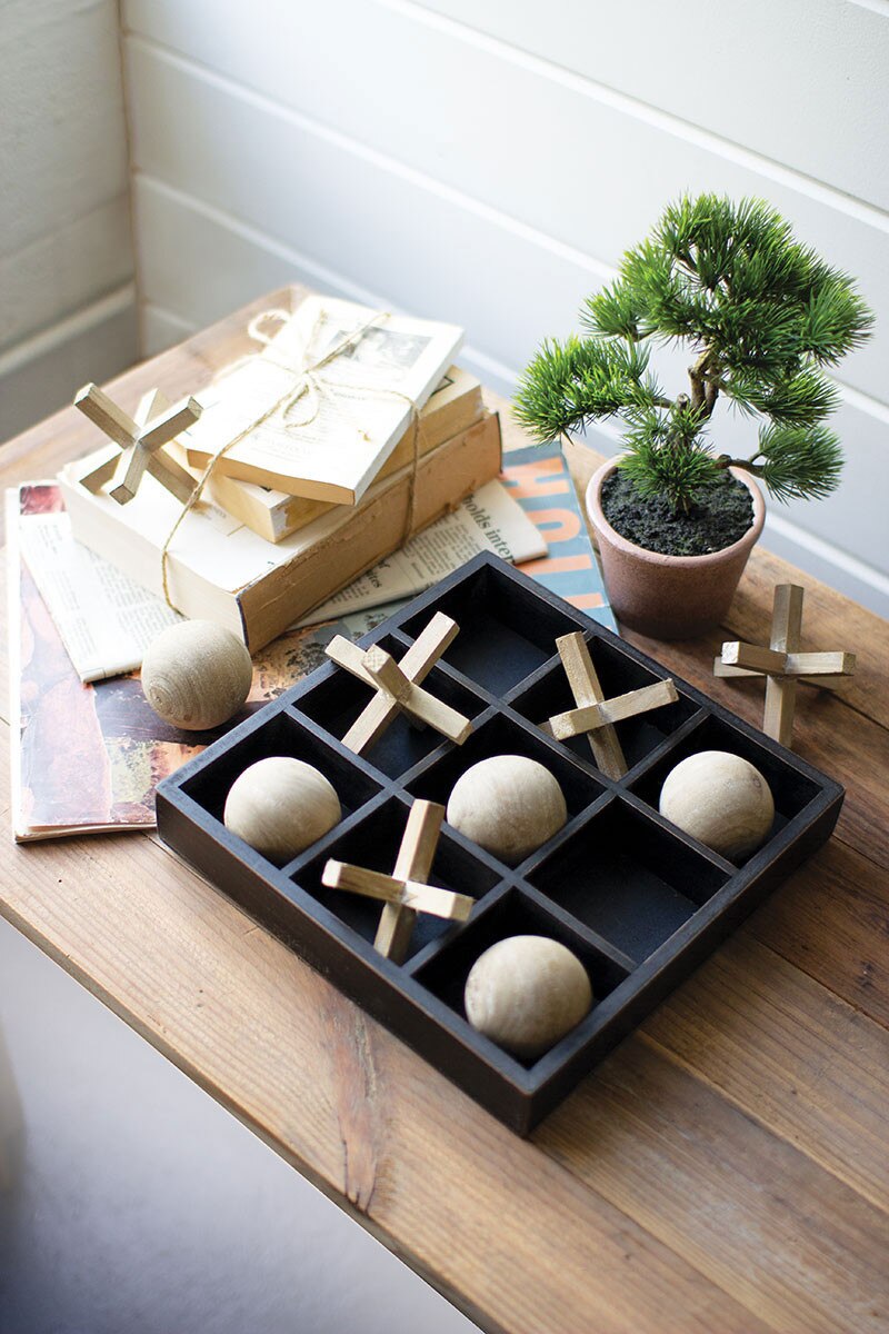 Wooden Tic-Tac-Toe Game Set with natural and black game pieces.